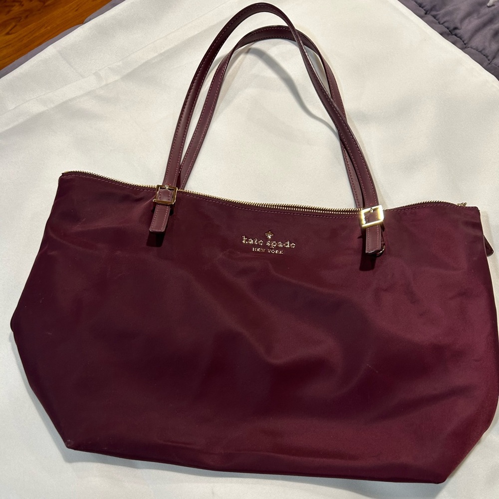 Gently used nylon KATE SPADE TOTE in beautiful burgundy color, gold hardware